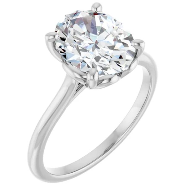 A Solitaire Oval Cut Lab Grown Diamond Engagement Ring with a large, oval lab diamond held by six prongs on a simple, polished silver band.